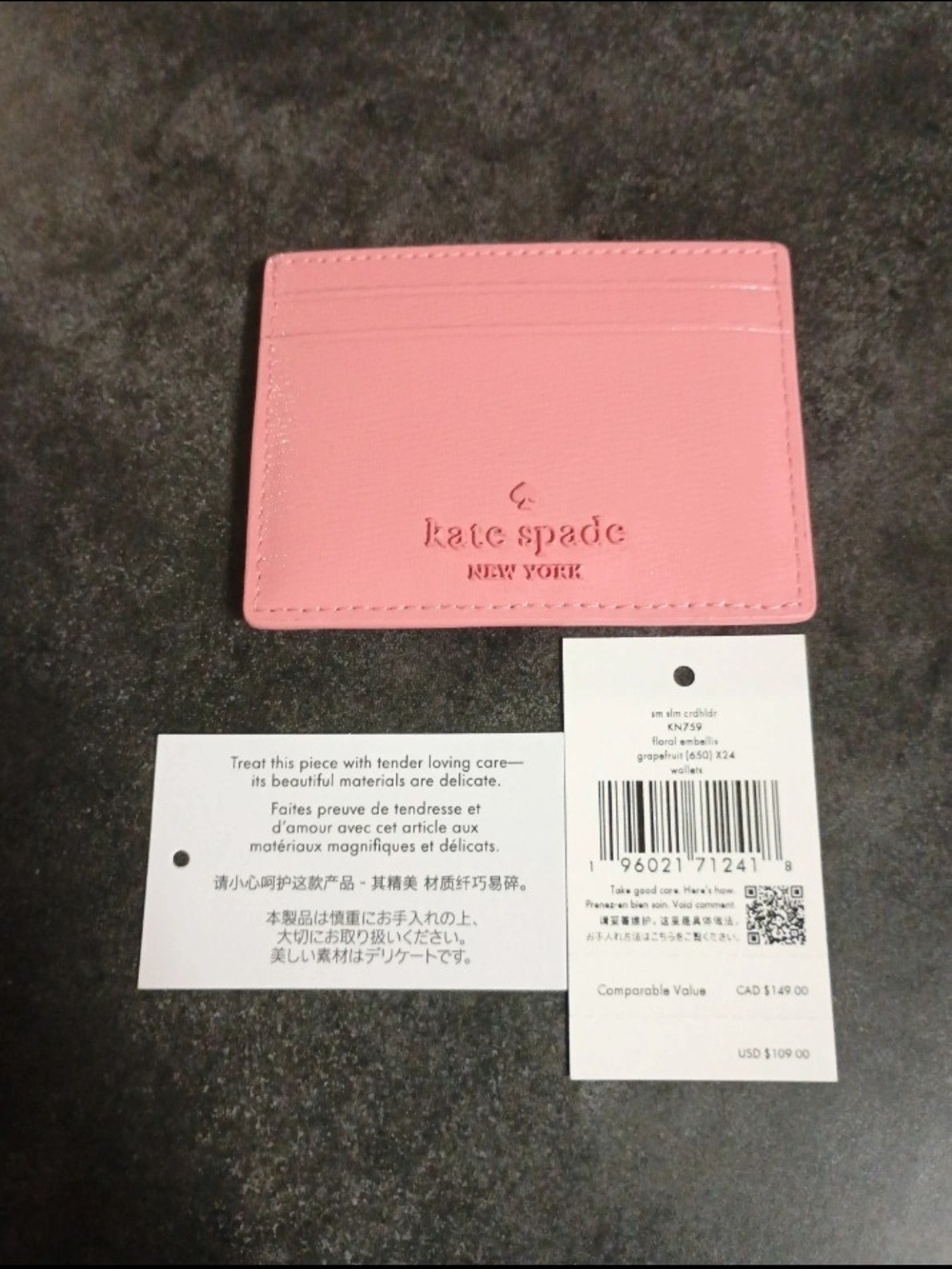 Kate Spade Pink Slim Card Holder with Embossed Flowers And Logo